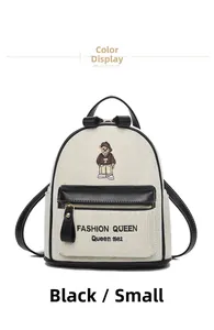 Detail of cartoon bear embroidery and fashion text on cream canvas backpack