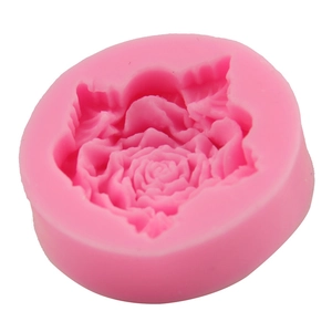 Pink round silicone mold featuring detailed rose flower and leaf designs for baking