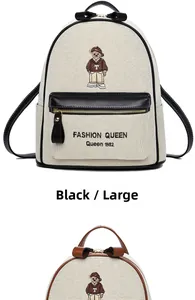 Detail of canvas backpack featuring bear embroidery and premium leather trim accents