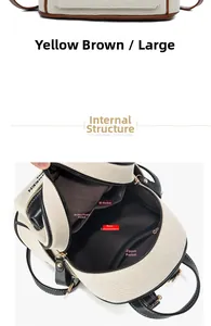 Detailed interior of yellow-brown canvas backpack showing main pocket and compartments