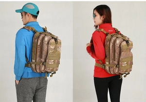 Detail view of tactical camo backpack featuring MOLLE system and adjustable padded straps