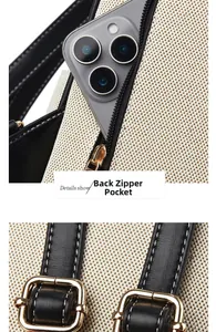 Detail view of back zipper pocket and gold metal buckle on canvas and leather backpack