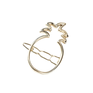 Golden hollow pineapple-shaped alloy hair clip hair accessory on white background