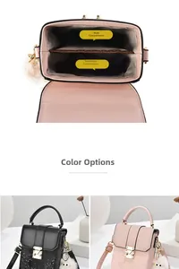 Detail view of pink and black snake pattern crossbody bags with plush toy charm