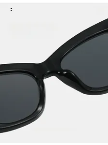 Detail shot of wide integrated nose pads on black cat-eye sunglasses for comfortable wear