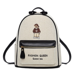 Canvas backpack with bear embroidery, black leather trim and golden zipper detail