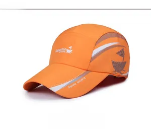 Detail view of orange waterproof sports cap with reflective strips and logo