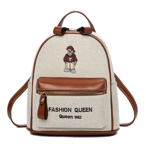 Minimalist cartoon bear canvas backpack with brown leather trim and fashion queen print