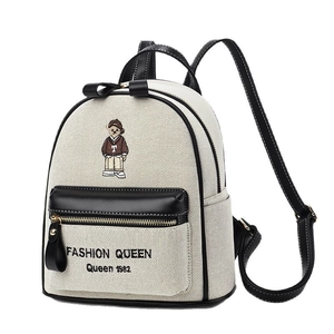 Off-white canvas backpack with cute embroidered bear and black leather trim for women