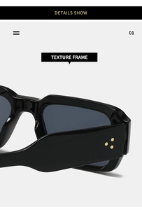 Macro shot of stylish black sunglasses frame featuring golden star rivet decorations