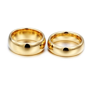 Pair of minimalist gold tungsten steel rings with mirror polished smooth finish