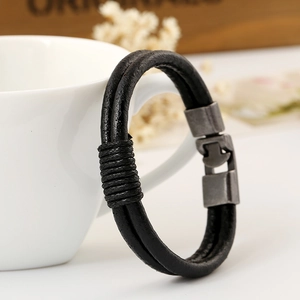 Vintage woven black leather bracelet for men featuring a retro metal interlocking clasp