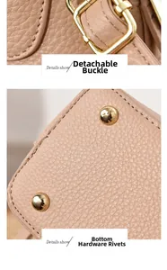 Détail du sac beige en cuir grainé avec mousquetons dorés et clous de fond protecteurs