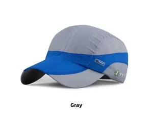 Detail of grey quick-dry sports cap showing breathable mesh side and blue sport label