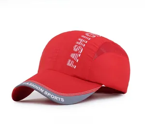 Detail of red quick-dry baseball cap with breathable mesh and reflective brim trim