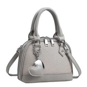 Elegant light gray dome shell handbag with litchi texture and metal heart charm