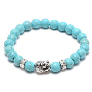 Detail of beaded bracelet with blue turquoise stones and silver Buddha charm