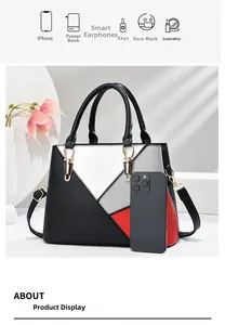 Detailed interior of color block handbag showing spacious storage for daily essentials