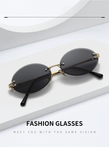 Macro detail of rimless oval sunglasses with gold twisted metal bridge and dark grey lenses