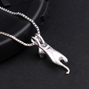 Detailed close-up of S925 sterling silver playful cat pendant with sleek box chain