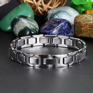 Polished silver-grey tungsten steel men's link bracelet on a stylish reflective base