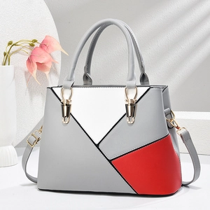 Elegant geometric color-block handbag in red, white and grey with double handles