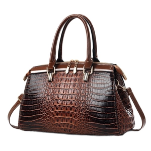 Dark brown faux crocodile leather handbag with glossy finish and gold hardware