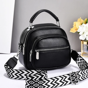 Black lychee texture crossbody bag with geometric wide strap and triple zippers