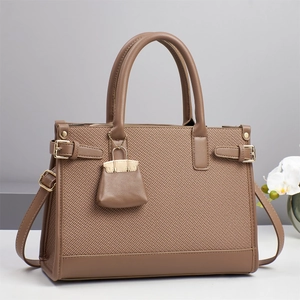 Elegant brown fabric tote bag with leather trim and detachable shoulder strap for women