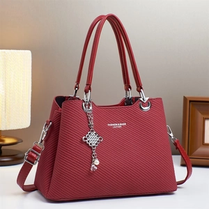 Red textured macaron handbag with silver Chinese knot charm and fashion leather logo