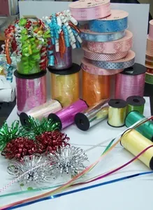 Assorted 1-inch mini star bows and patterned ribbons for Christmas gift wrapping
