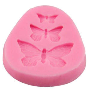 Pink silicone fondant mold featuring three different sizes of bow patterns for DIY baking