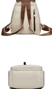 Rear view of cream PU leather backpack with lychee texture and brown webbed straps