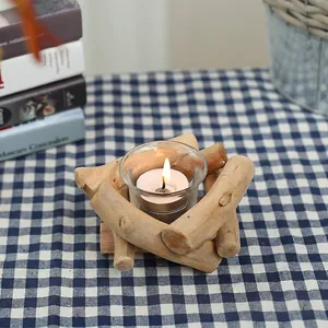 Rustic driftwood tea light candle holder with natural wood sticks and glass cup