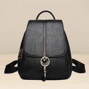 Practical black faux leather women backpack with elegant gold smiley face and ribbon detail
