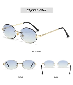 Detail view of gold rimless sunglasses with gradient lenses and textured temples