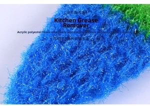 Macro detail of acrylic fiber texture on blue and green strawberry dishcloth