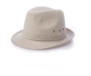 Detail shot of breathable straw fedora hat featuring metallic side ventilation eyelets