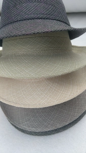 Detailed view of four men's summer fedoras in purple check and solid woven textures