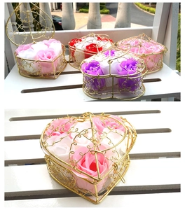 Detail of heart-shaped gold wire baskets with artificial soap roses in various colors