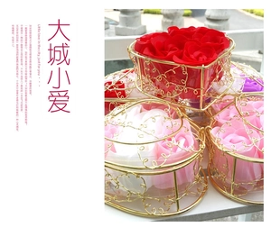 Detail view of a heart-shaped gold wire gift basket filled with colorful soap roses