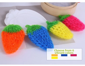 Detail of strawberry shaped handmade crochet dishcloths in vibrant kitchen setting