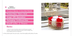 Detail view of 6 artificial soap roses in a heart-shaped golden iron basket gift set