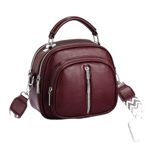 Sac à main bordeaux en cuir grainé avec compartiments zippés et bandoulière large