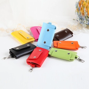 Close-up of colorful PU leather coin purses with metallic buttons and key ring hooks