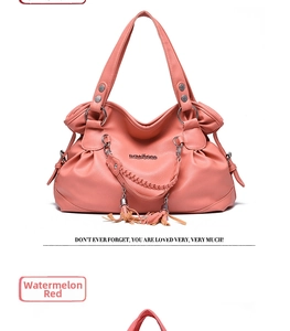 Detail of watermelon red soft leather tote bag with tassels and silver metal hardware
