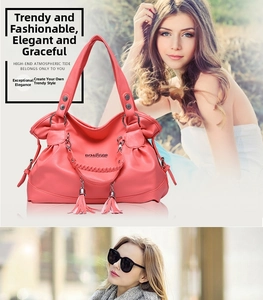 Detail of coral red leather tote bag showing woven handles and stylish side tassels