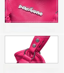Detailed macro view of pink pebbled leather with silver logo and metal hardware