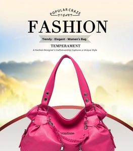 Detail of rose pink pebbled leather handbag with woven handles and bell charm pendant