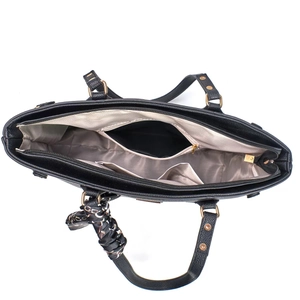 Interior view of black pebbled leather tote bag with compartments and champagne lining